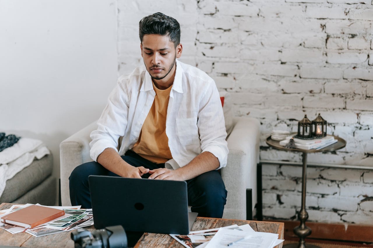 Person working on a laptop providing virtual assistant services from home