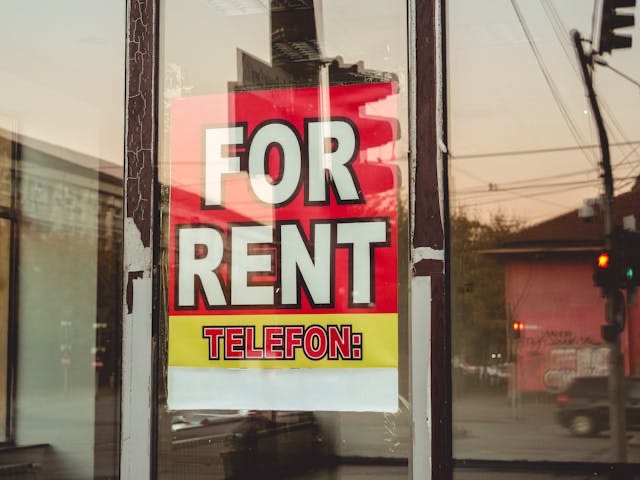 A for rent sign on window